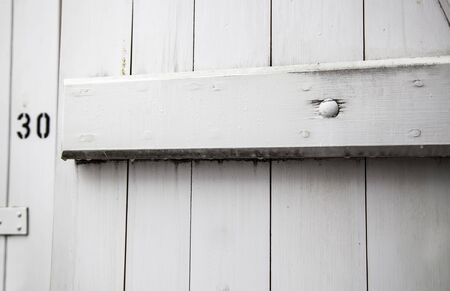 White wood door, protection and decoration detail