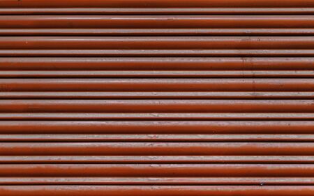 Red metal wall, metallic background detail painted red, protection