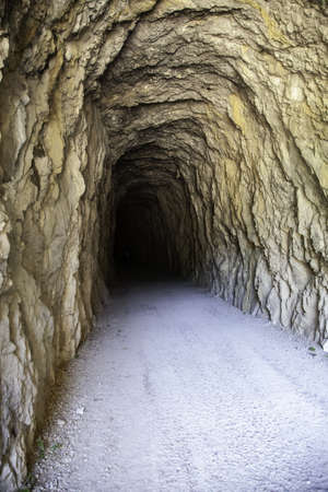 Deep stone tunnel, detail of ancient cave on a mountain