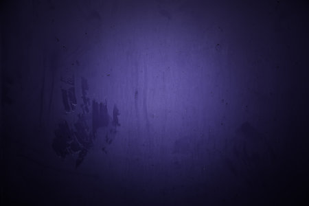 Dirty and metallic blue background, detail of color painted wallの写真素材