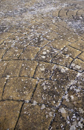 Old and abandoned pedestrian pavement detailの写真素材