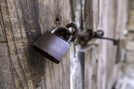 Security and protection detail on an old wooden doorの写真素材