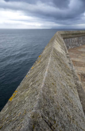 Detail of old cement dam on a beach in Spainの写真素材