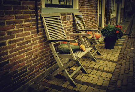 Pumpkins on a chair, Halloween decoration detailの写真素材
