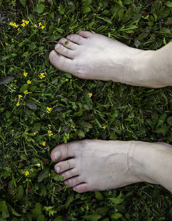 Detail of woman resting on the grass, relaxing in nature