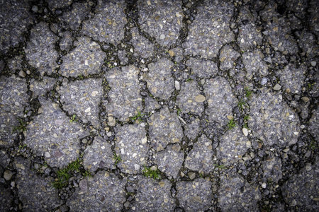 Detail of old abandoned and ruined asphalt roadの写真素材