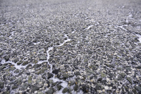 Detail of frozen mountain road in winterの写真素材