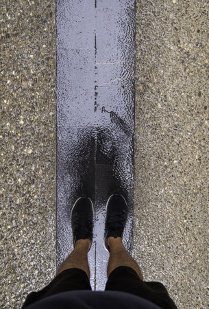 Detail of young man on a roadの写真素材