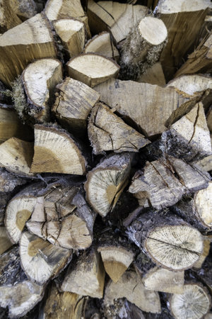 Detail of pieces of tree wood to burn, firewood and heat in the cold winterの写真素材