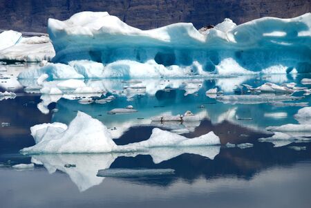Iceberg reflections on the lake Jokulsarlon