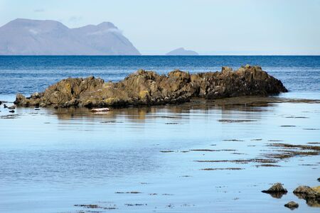 reflected in the sea cliffs of the peninsula in Iceland Vatnsnessの写真素材