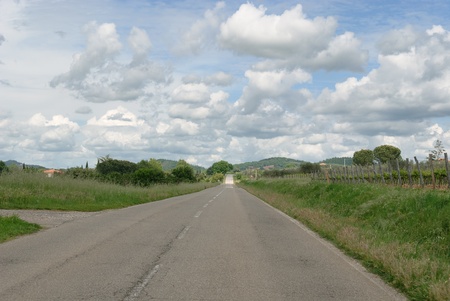 Straight road in the hills of Siena in Tuscanyの写真素材