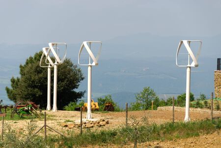 four vertical wind turbines in Tuscanyの写真素材