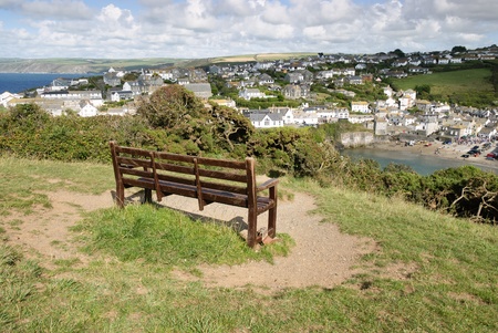 bench with a panoramic view of Port Isaac in Cornwallの写真素材