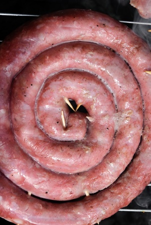 roll of sausage on the grillの写真素材