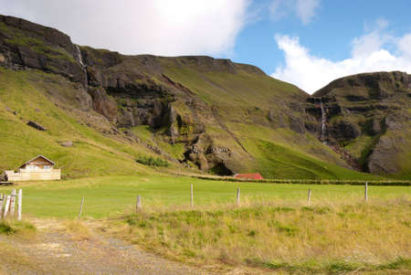 waterfall in the vicinity of Vik in Icelandの写真素材