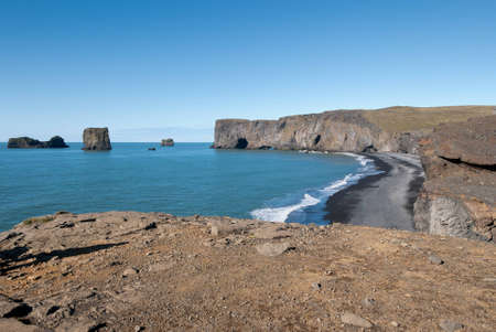 cliffs and beach at Vik in Icelandの写真素材