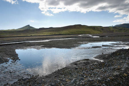 reflected on the river high above Vik in Icelandの写真素材