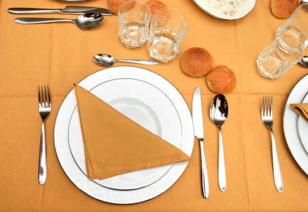 bread on the table with yellow tablecloth の写真素材