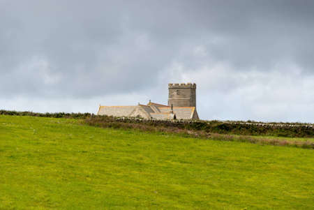 castle between grass and sky at Tintagel in Cornwallの写真素材