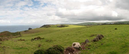 overview of a stretch of coast at Tintagel in Cornwallの写真素材