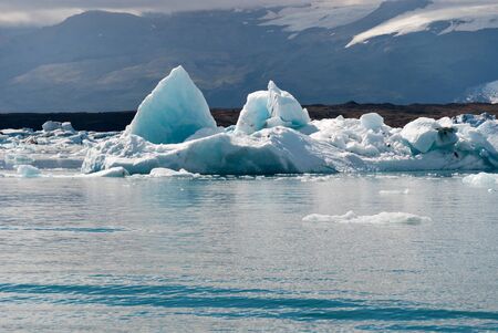 Icebergs and reflections on Lake Jokulsarlonの写真素材