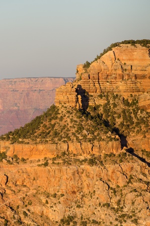 shaped shadow photographer with tripod at sunset over the Grand Canyon National Park in Arizona in the United States of Americaの写真素材