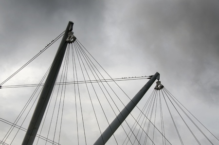 crane with steel cables and seagulls on the derrick in Genoa