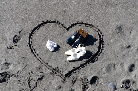 heart drawn in the sand on the beach of Camogliの写真素材