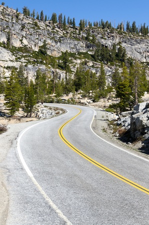 road with curves in Yosemite National Park in Californiaの写真素材