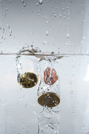 just dropping coins into the waterの写真素材