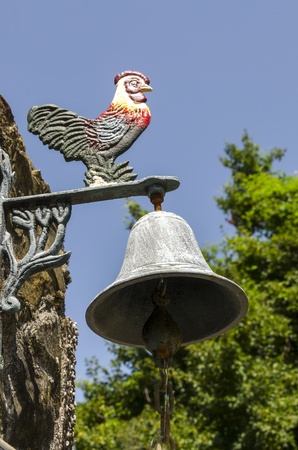 bell with iron roosterの写真素材