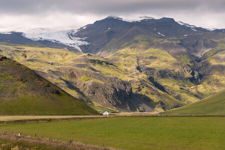 mountains and black sky in Vik in Icelandの写真素材