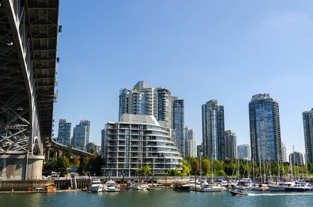 Skyscrapers of glass and mirrors viewed from Granville in Vancouverの写真素材