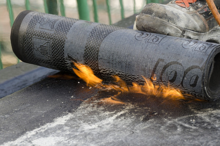 During welding flame of a waterproofing membrane on a roof
