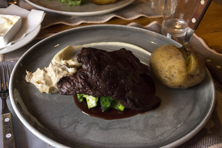 dish with whale steak in Norway in Lofotenの写真素材