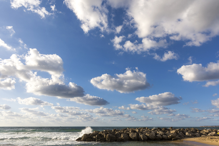 Crystal clear sea and frothy waves on the beaches of Palermo in Sicily in Italyの写真素材