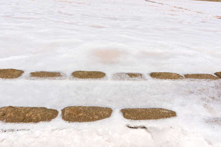 salt collection at the saltworks of Trapani in Sicily in Italyの写真素材