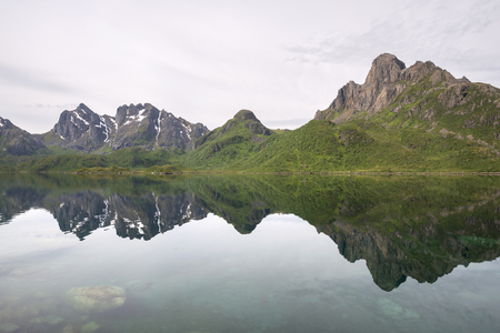 Nyksund reflections on the water around Norway