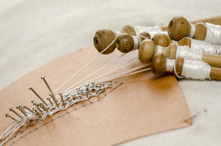 the Tombolo, a particular processing of the interweaving of threads to create fabrics in Italy