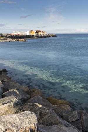 landscape between sea and mountain in Andenes in Lofoten on Norway along National Tourist Route Andoyaの写真素材