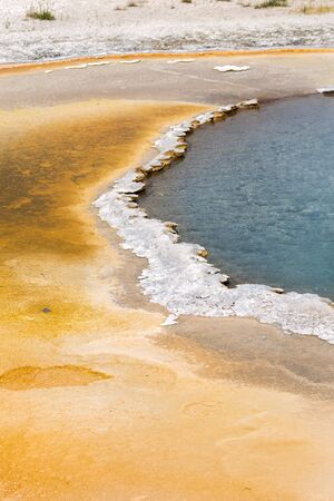 Geyser and hot spring in the old faithful basin in Yellowstone National Park in Wyoming