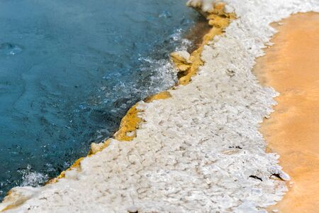 Geyser and hot spring in the old faithful basin in Yellowstone National Park in Wyoming