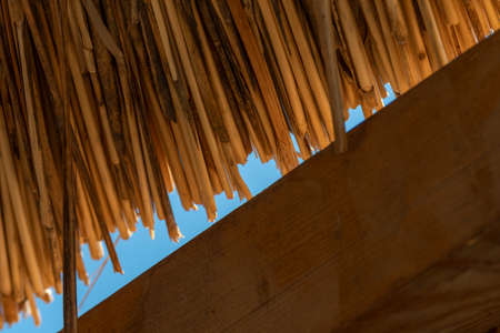 straw umbrellas on the beach at at Puta Zeza beach in Athens in Greeceの写真素材