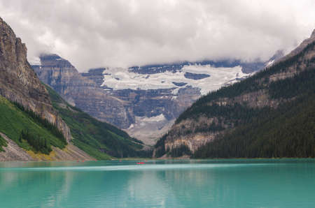 Lake Louise in cloudy day in summer in Banff National Park, Alberta, Canadaの写真素材