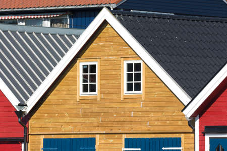 colorful wooden houses on the sea in Osoyro in Norwayの写真素材