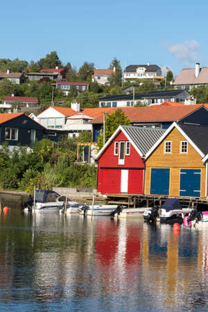 colorful wooden houses on the sea in Osoyro in Norway