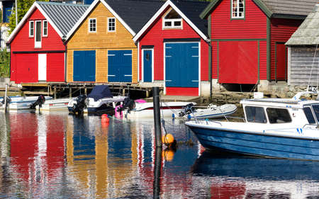 colorful wooden houses on the sea in Osoyro in Norwayの写真素材