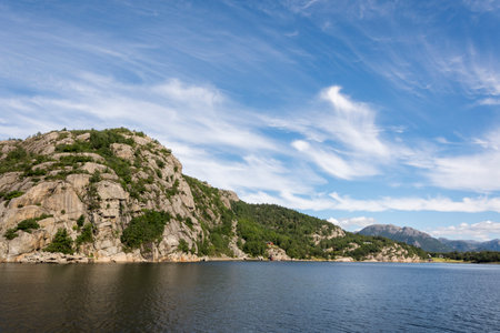 rock, islands, overhangs, cliffs and mountains overlooking the sea during a cruise on the Lysefjord...