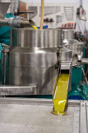 transformation of olives into oil in an oil mill in greeceの写真素材
